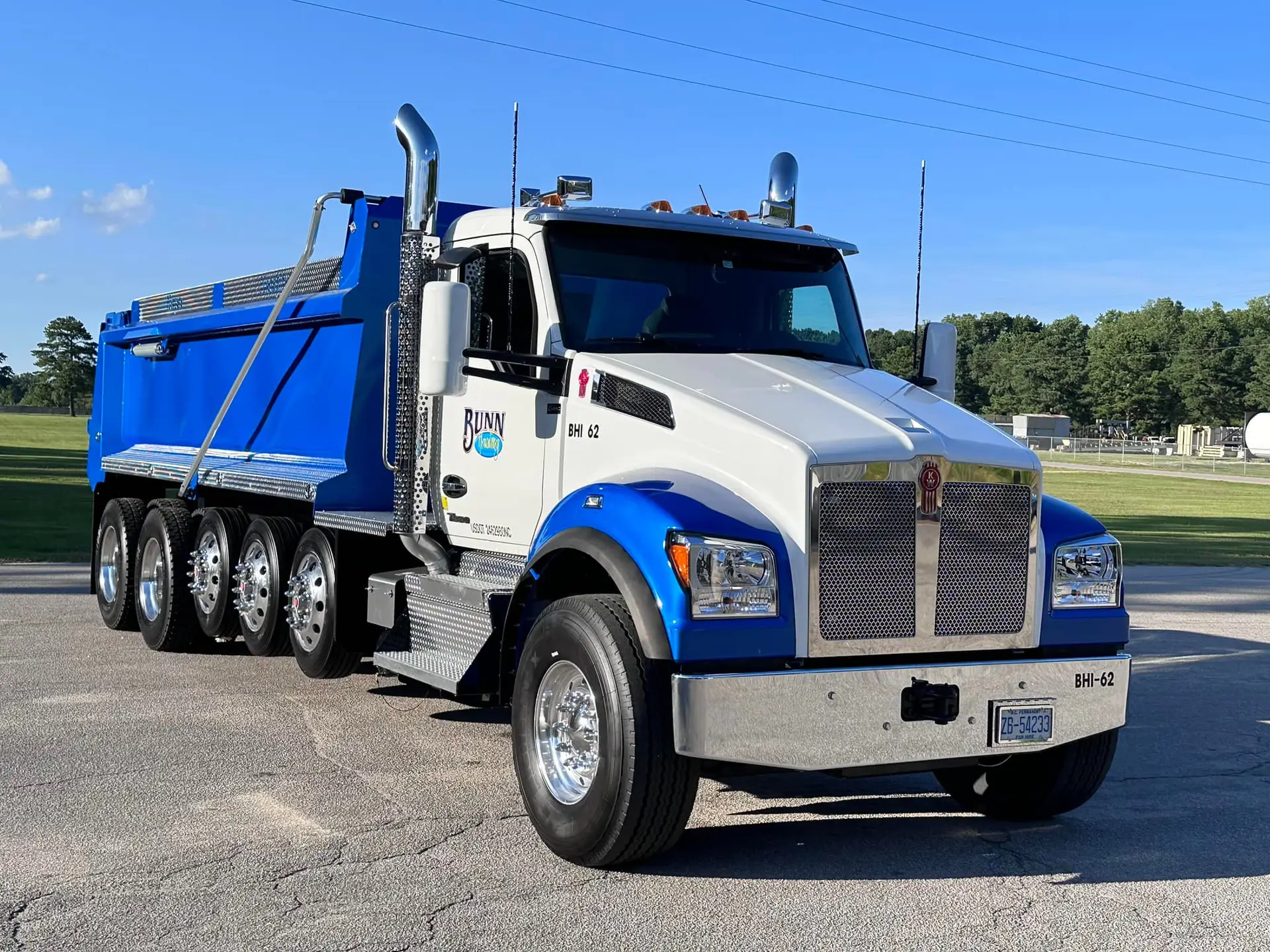 Blue and white dump truck ready for hauling service