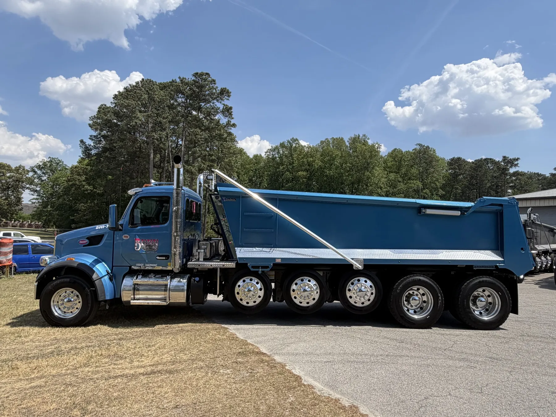 Bunn Hauling blue Peterbilt quad-axle dump truck with Godwin dump body